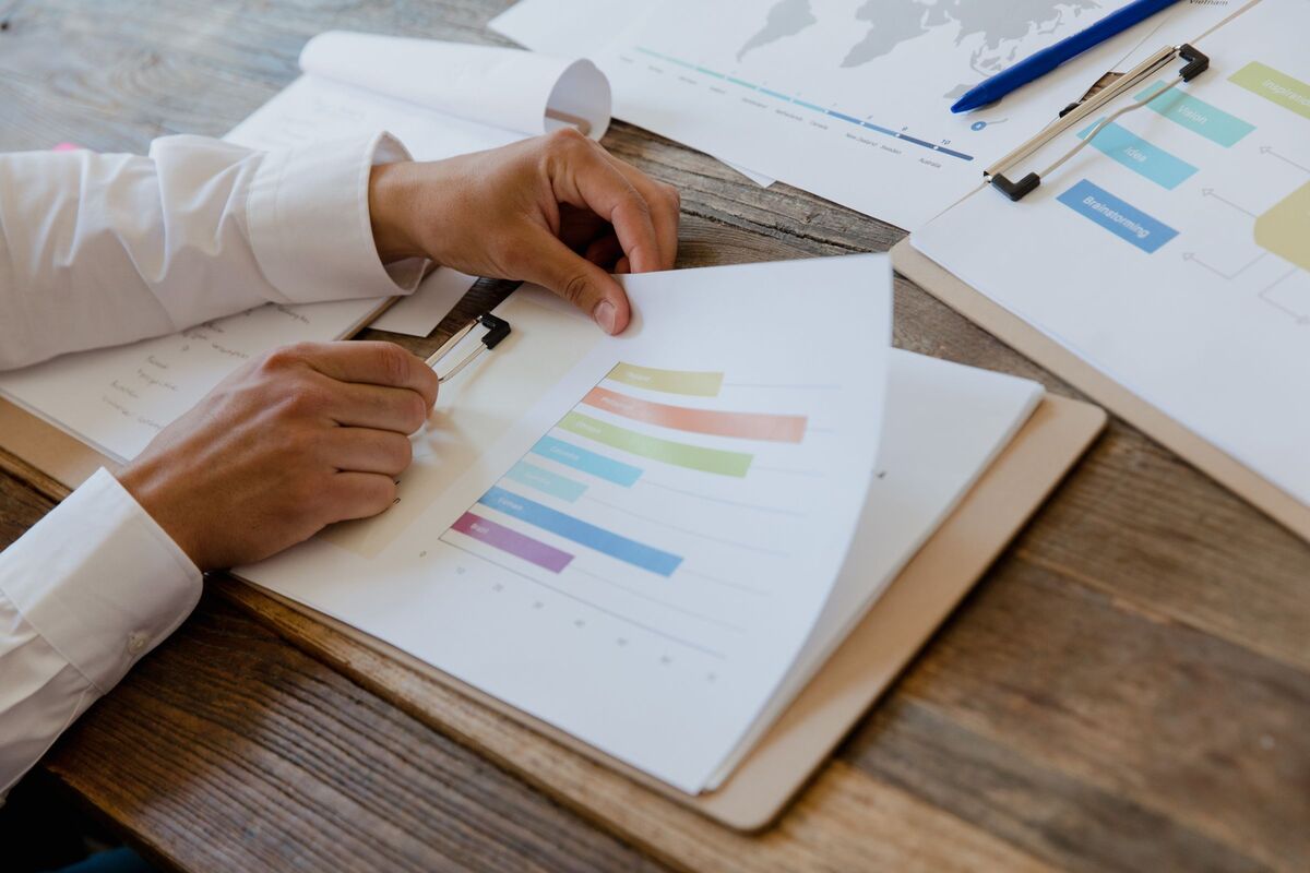 Printed research findings and charts laid out for analysis